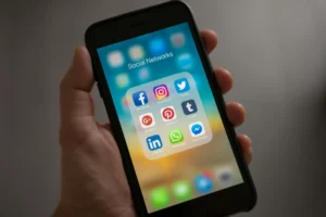 a phone showing social media app tiles